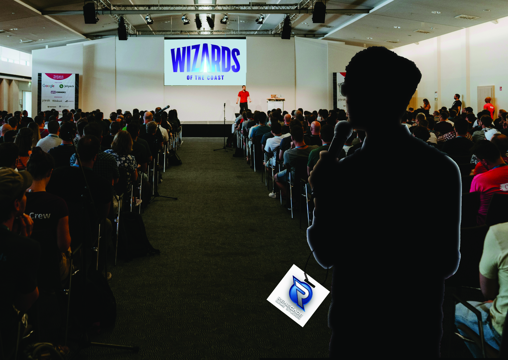 A Renegade Studios speaker tries to make himself heard from the back of a room where everyone is paying attention to Wizards of the Coast.