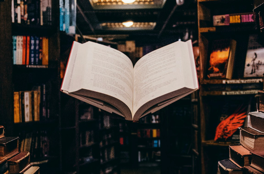 A book floats in midair in a bookstore.